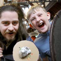 Viking and laughing boy holding shields