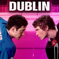 Heated Rivalry Club Dublin - 2 men in different jerseys, crouched head to head in football pose.