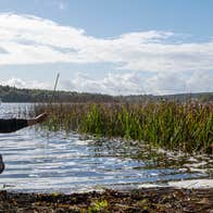 A woman and child by the water in Newtowngore in County Leitrim