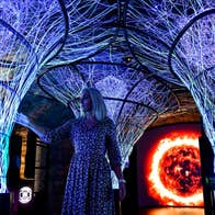 Woman viewing a light installation at EPIC