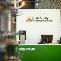 Irish Family History Centre reception desk with three computer monitors