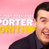 A smiling man scratching his head, against bright pink background.