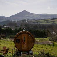 An outdoor sauna with a view of the Dublin Mountains