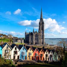 Colourful buildings in front of a cathedral in Cobh, Cork