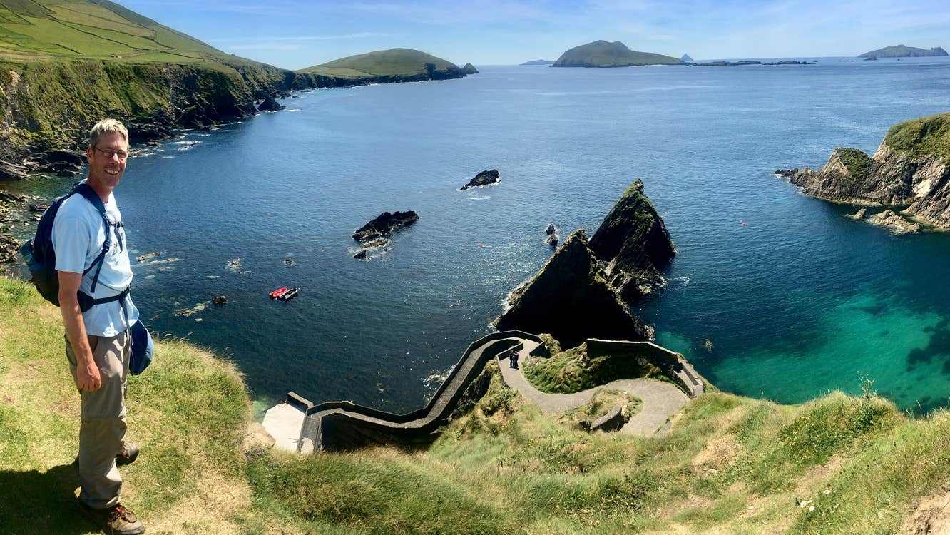 Man standing beside cliff edge