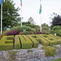 The word Enfield spelled out as a hedge in shrubbery as you enter town