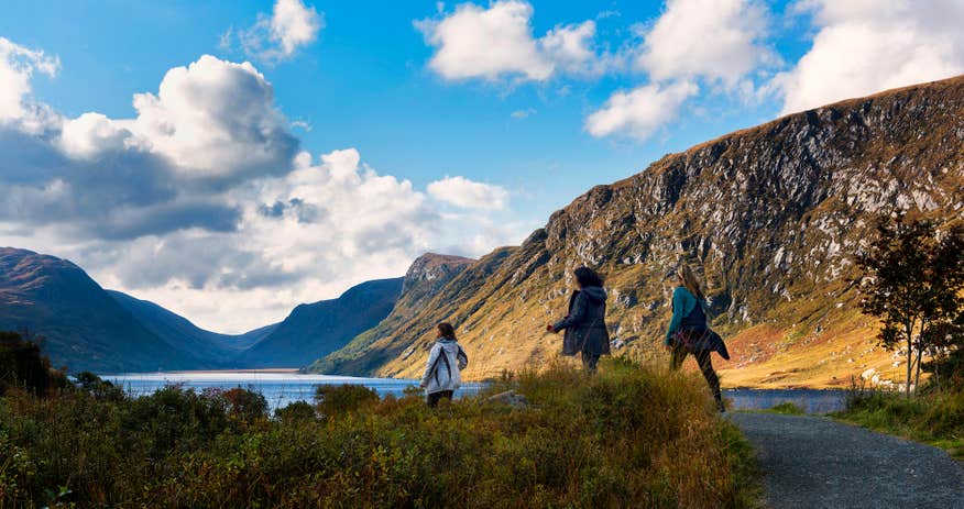 Three people hiking in the Glenveagh National Park in County Donegal.