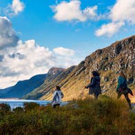 Three people hiking in the Glenveagh National Park in County Donegal.