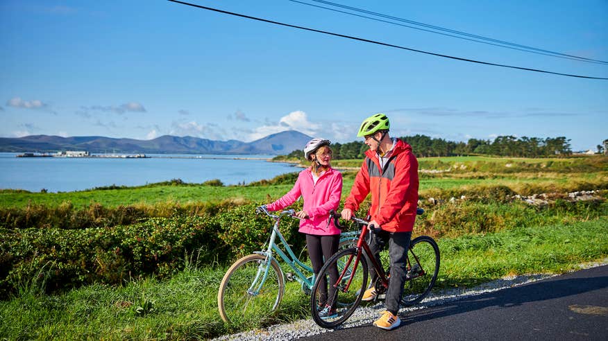Cyclists on the Tralee-Fenit route of the Kingdom of Kerry Greenways in Co Kerry