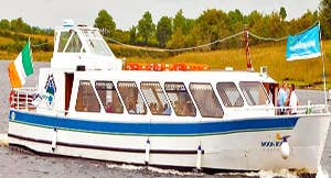 A boat on the water with Irish flag