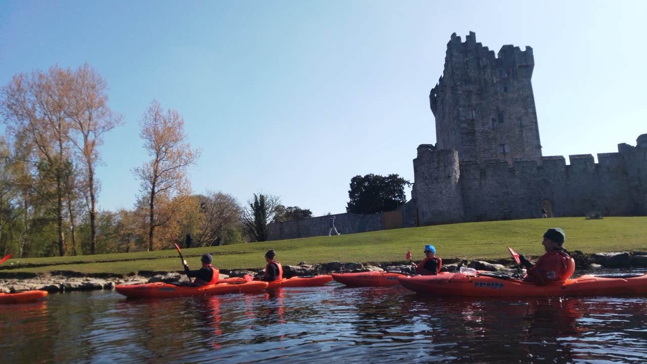 A group of kayakers starting their tour at Ross Castle with Killarney Lakes Kayaking Tours