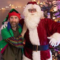 Santa and his Helper in front of the tree