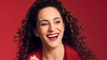 Janine Harouni with This is What You Waited For Tour, a laughing woman in red shirt.