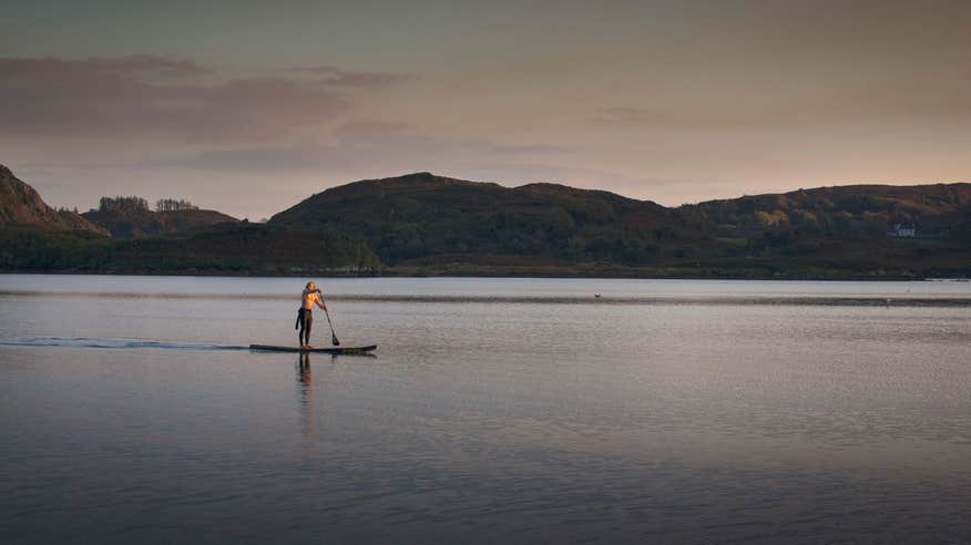 A person Sup on Lough Hyne at sunset