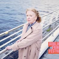 Mam and Love and Woo - Liam McCarthy. Joan Sheehy standing on a quay by a river