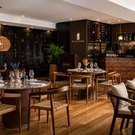 Dining room of a restaurant with chairs and tables set for service