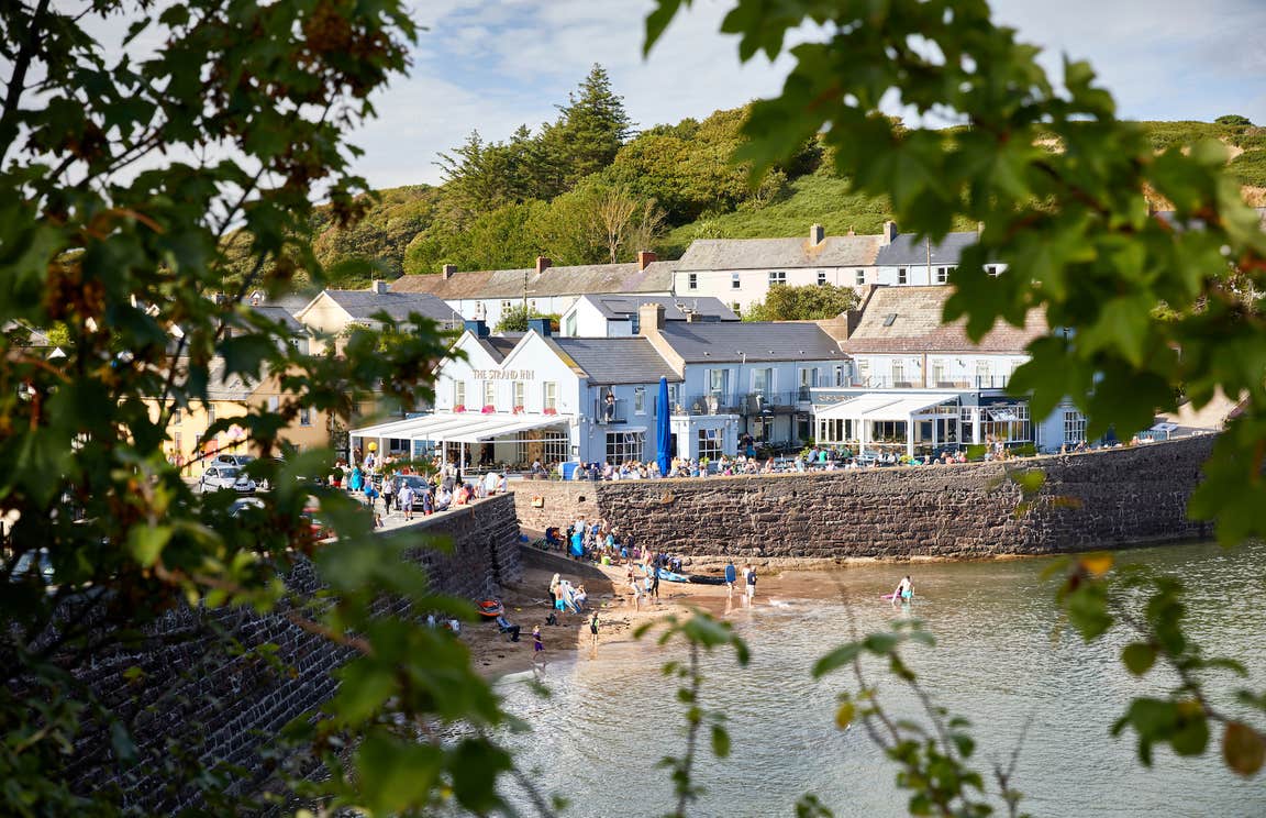People getting into the water by the Strand Inn in Dunmore East, County Waterford.