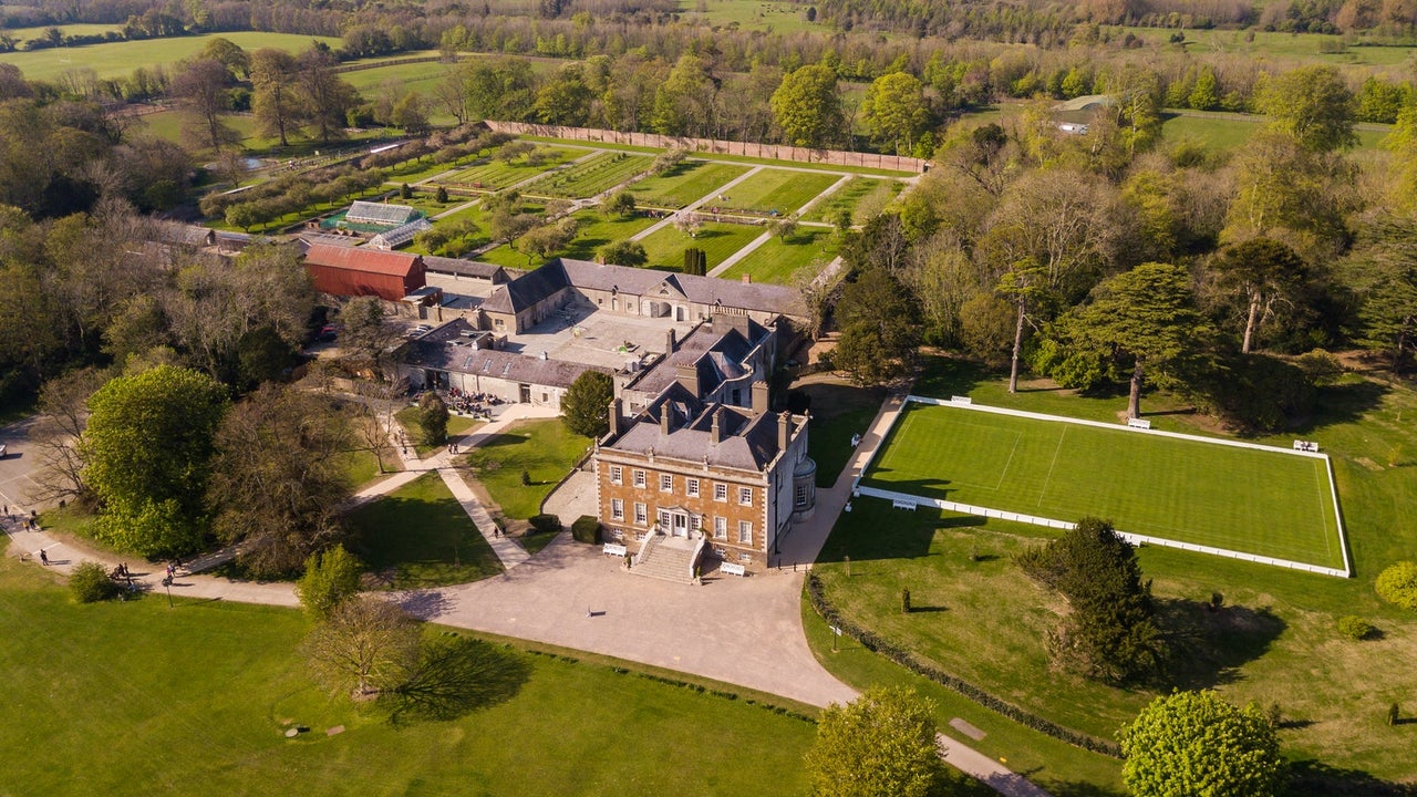 Aerial view of a large Georgian house on a large estate