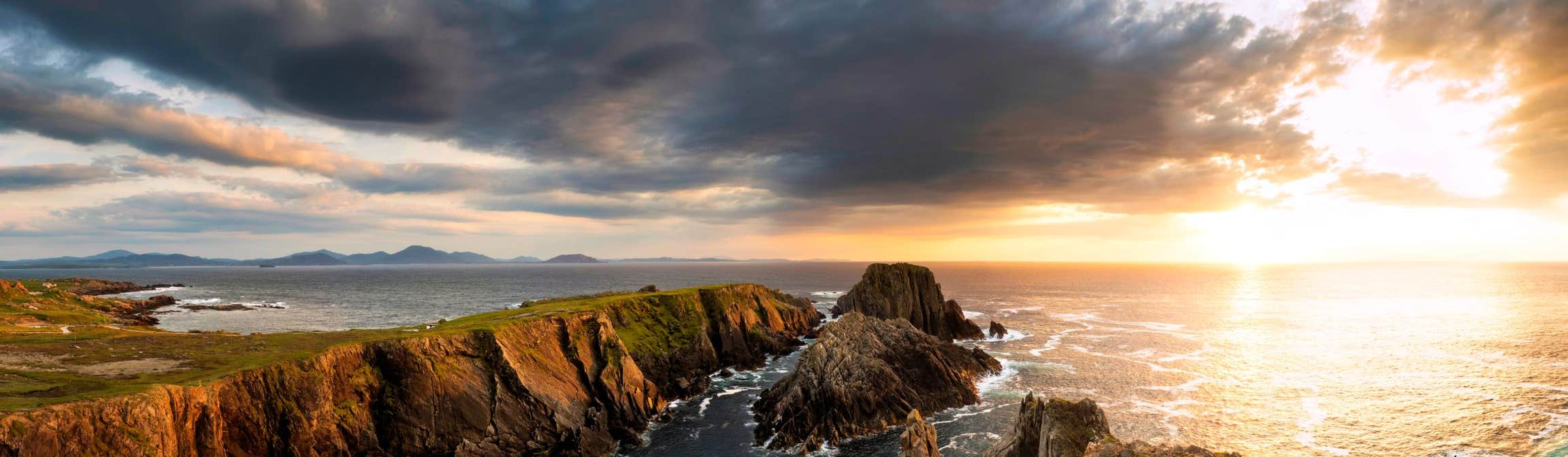 A sunset behind rocks at Malin Head in Donegal