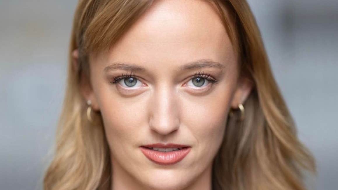 Headshot of woman with long blonde hair