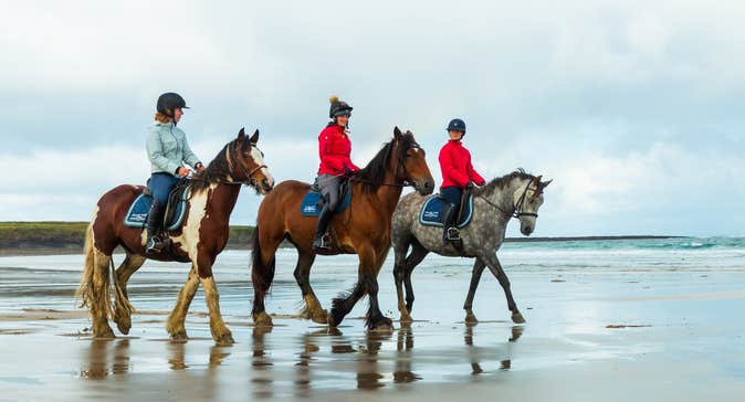 Horse riders on Streedagh Beach in Co Sligo