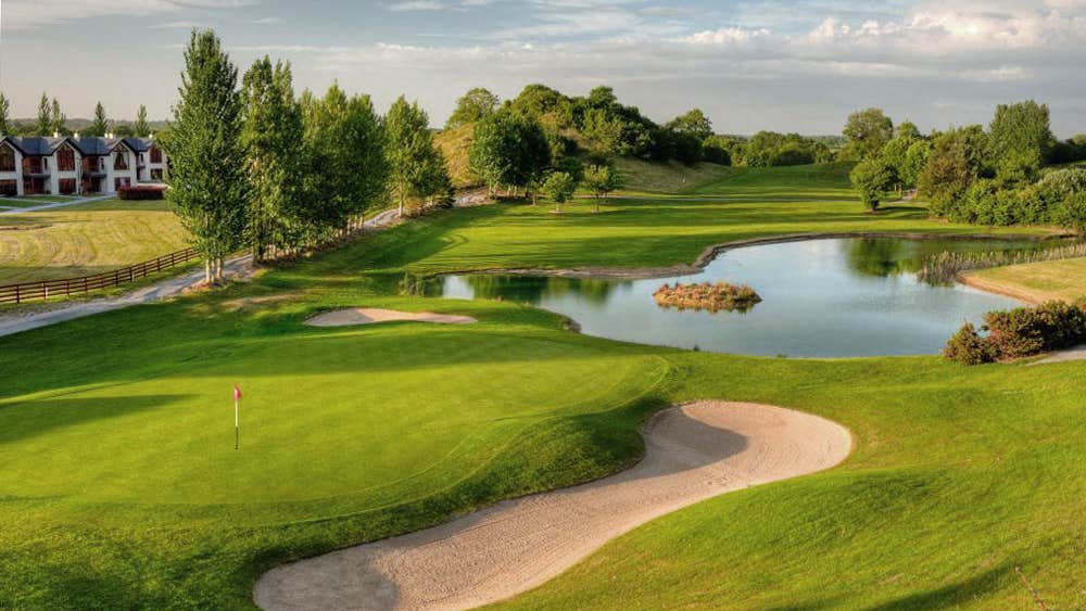 Esker Hills Golf Club aerial view of the green, sand trap and water feature