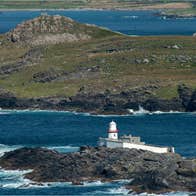 Landscape view of Valentia Island Lighthouse with the sea in the background