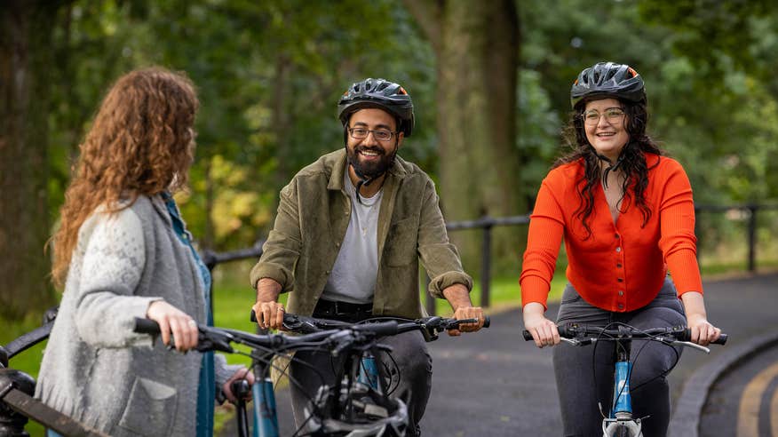 Three people cycling in Phoenix Park.