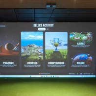 A large screen with golfing options on display