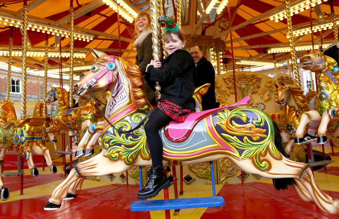 A family on a carousel ride