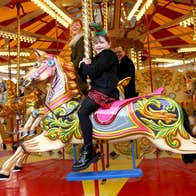A family on a carousel ride