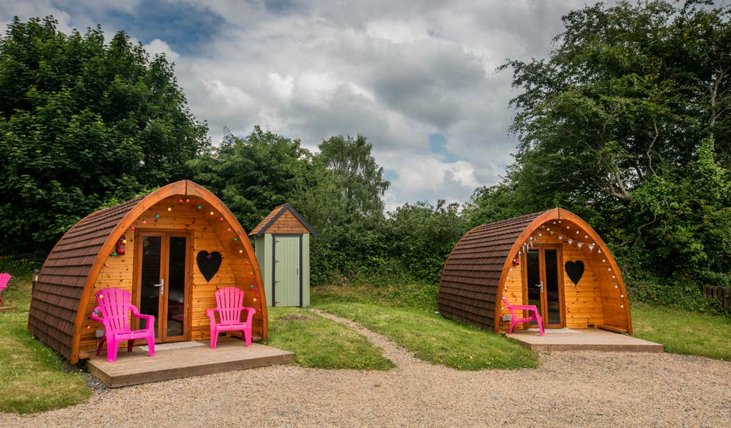 Two wooden glamping huts at Pod Umna Village in Portumna, Galway.