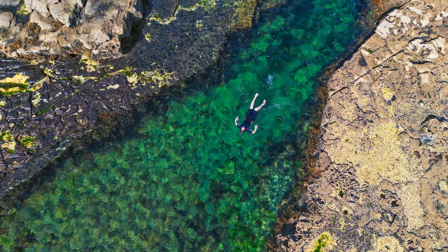 A man swimming in Poll Gorm in Easkey, County Sligo