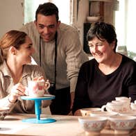 People chatting and admiring beautiful pottery
