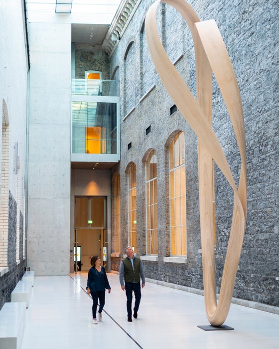 Couple looking up at a sculpture at the National Gallery of Ireland.