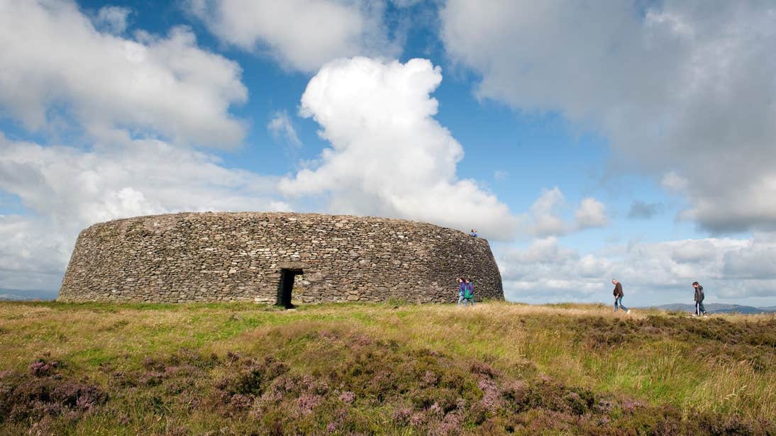 People walking towards the ruins of Grianan of Aileach, Donegal
