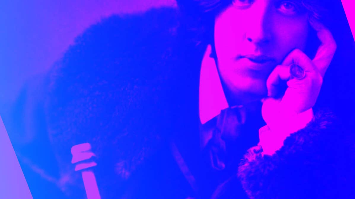 Blue and pink tinted photo of man looking thoughtful resting face on left hand.