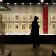 visitor exploring 'A Dubliner’s Collection of Asian Art: The Albert Bender Collection'