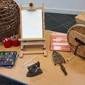 National Drawing Day at Turlough Park, a small collection of items on a table including pencils and a small easel with white paper