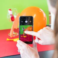 Someone is taking a photo with a smartphone.
