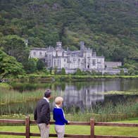 People admiring the lakeshore views at Kylemore Abbey