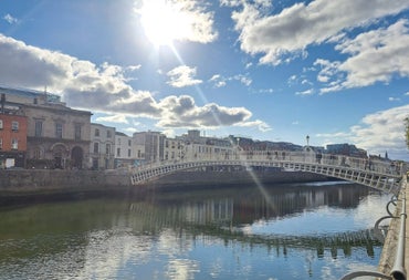 Bridge over a river and a blue sky with clouds