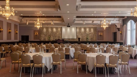 Function room with tables and chairs