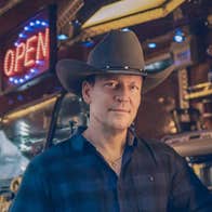 Robert Mizzell Dance - a gently smiling man in a large brown cowboy hat
