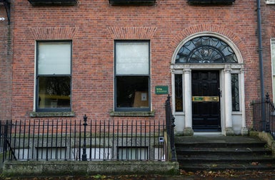 A red bricked exterior of a Georgian town house on a city street