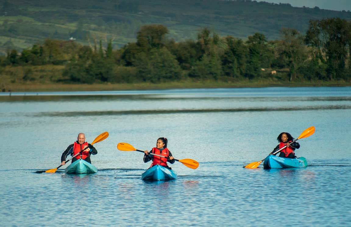 Three people kayaking in Lough Allen in Drumshambo, County Leitrim
