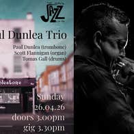 Dublin Jazz Co-op; Paul Dunlea Trio, dark photo of a man playing a trombone