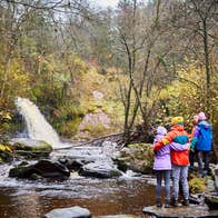 Hikers at Glebarrow Waterfall in the Slieve Bloom Mountains in Co Laois