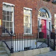 Red brick Georgian terrace in Dublin city with red doors
