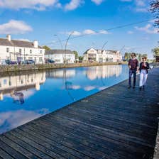A couple walk the boardwalk along by the Royal Canal in Maynooth